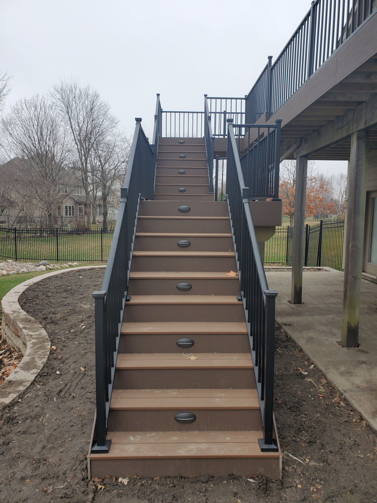 Deck - large backyard second story metal railing deck idea with no cover