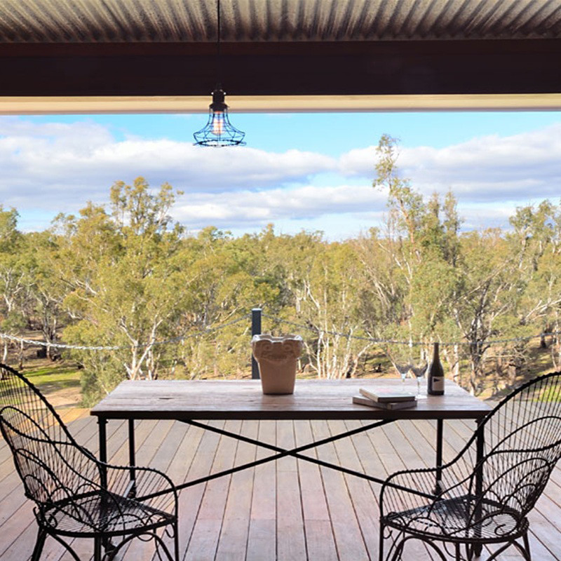 This is an example of a mid-sized country balcony in Melbourne with a roof extension.
