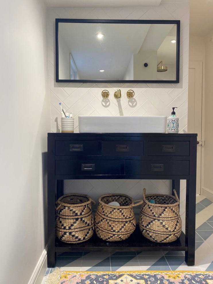 Small contemporary kids bathroom in Other with black cabinets, an open shower, a one-piece toilet, white tile, ceramic tile, white walls, ceramic floors, a console sink, wood benchtops, blue floor, an open shower, black benchtops, a single vanity and a freestanding vanity.