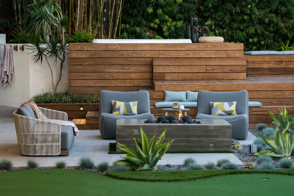 This is an example of a mid-sized contemporary backyard patio in San Diego.