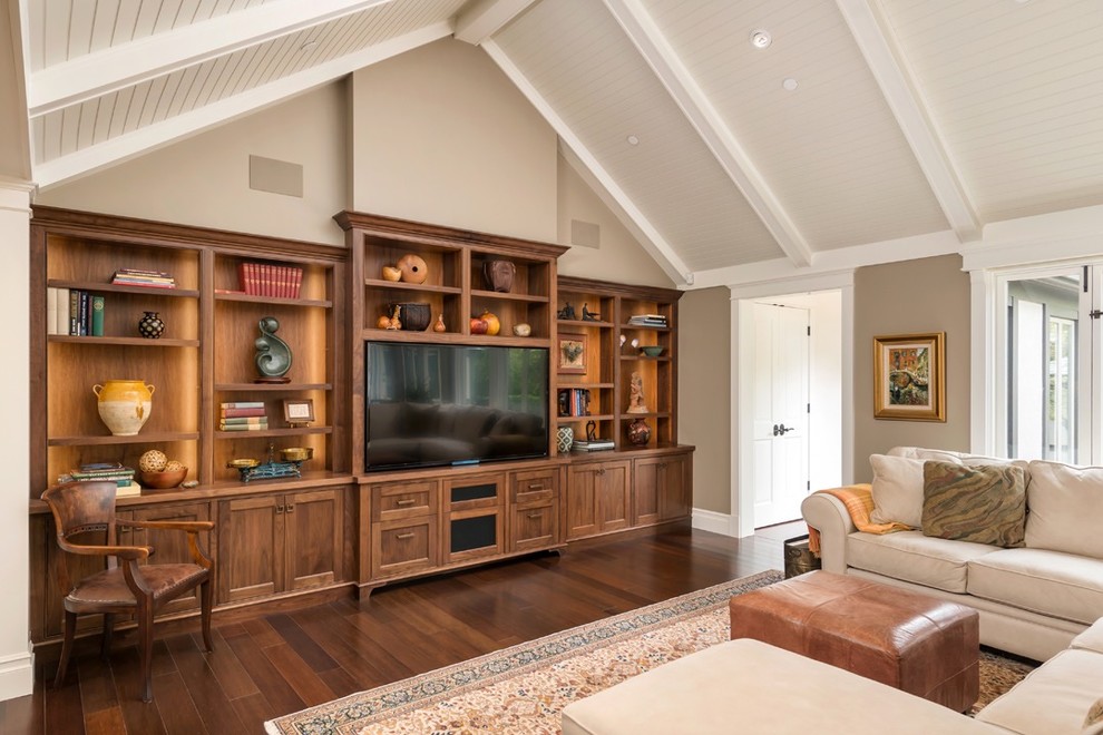 Traditional enclosed living room in San Francisco with brown walls, dark hardwood floors and a built-in media wall.