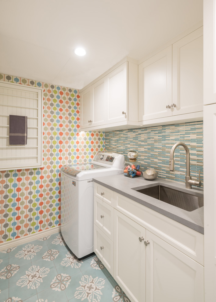 This is an example of a mid-sized transitional l-shaped utility room in Dallas with an undermount sink, shaker cabinets, white cabinets, quartz benchtops, multi-coloured walls, concrete floors, a side-by-side washer and dryer and blue floor.
