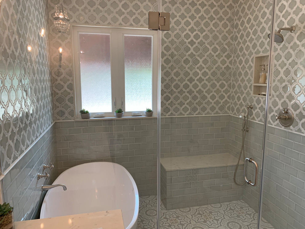 Inspiration for a large traditional master wet room bathroom in Los Angeles with furniture-like cabinets, dark wood cabinets, a freestanding tub, gray tile, ceramic tile, white walls, ceramic floors, an undermount sink, quartzite benchtops, multi-coloured floor, a hinged shower door and grey benchtops.