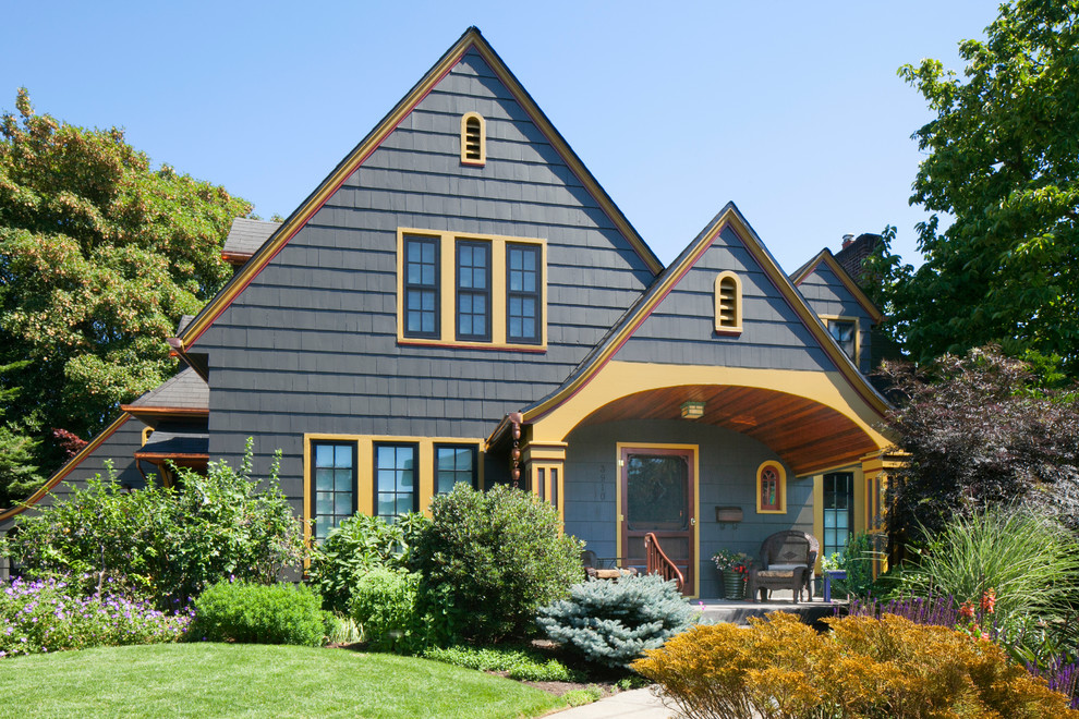 Inspiration for a mid-sized arts and crafts two-storey grey exterior in Portland with wood siding.