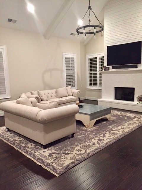 This is an example of a modern open concept family room in Birmingham.