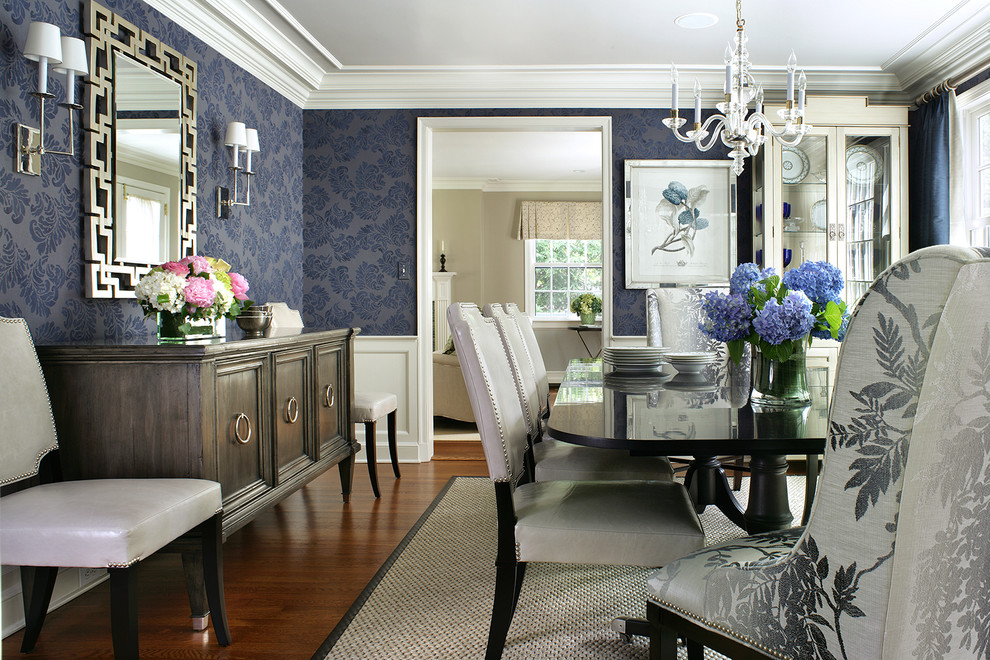 Photo of a large traditional separate dining room in New York with blue walls, dark hardwood floors and no fireplace.