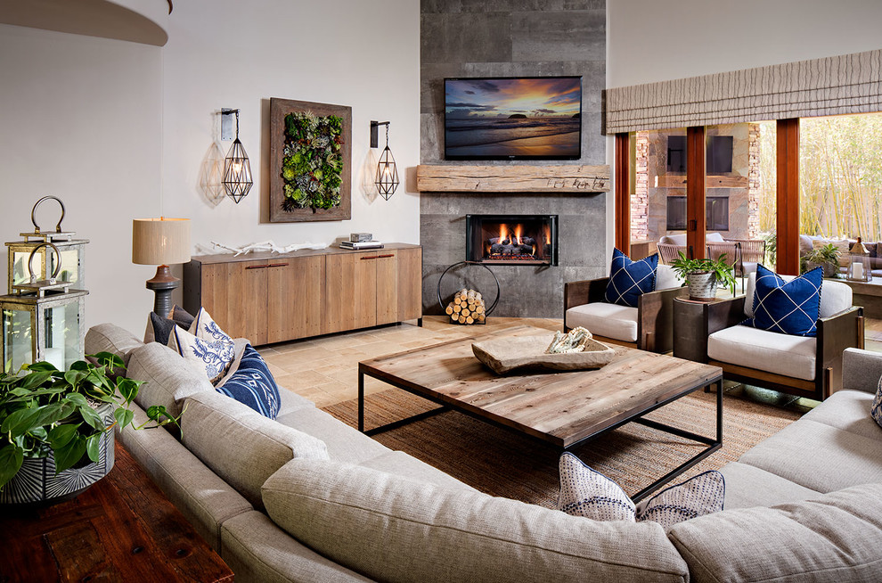 This is an example of a mid-sized eclectic open concept living room in San Diego with beige walls, a corner fireplace, a concrete fireplace surround and travertine floors.