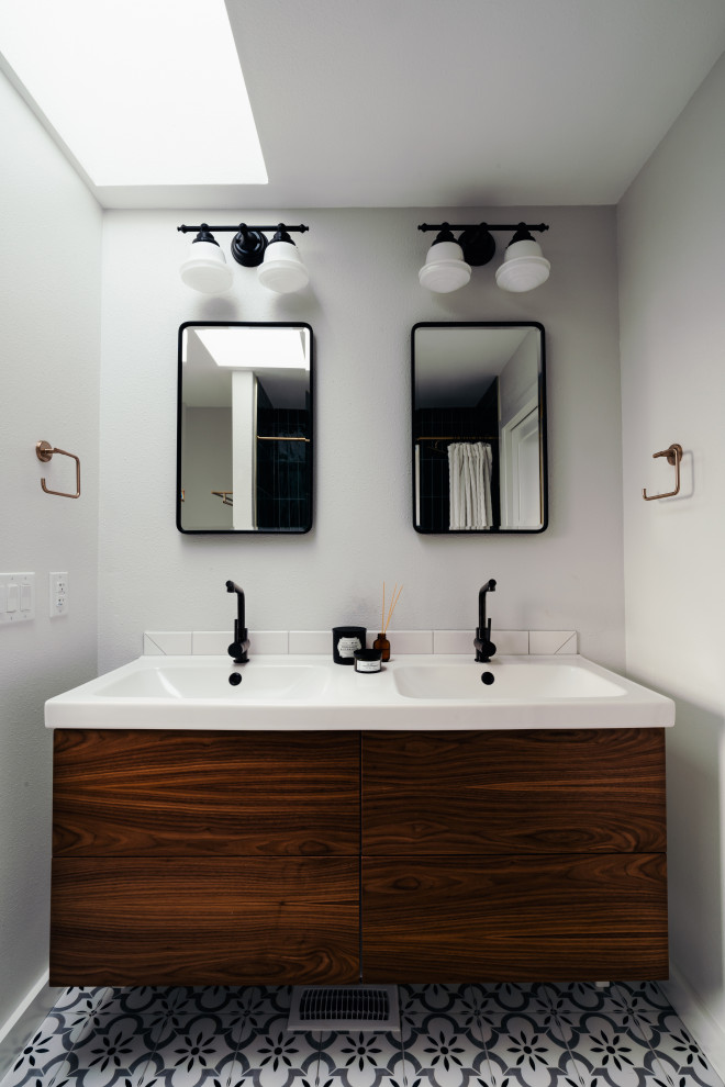 Design ideas for a medium sized retro grey and white ensuite bathroom in Seattle with flat-panel cabinets, medium wood cabinets, an alcove bath, an alcove shower, porcelain flooring, engineered stone worktops, a shower curtain, white worktops, double sinks and a floating vanity unit.
