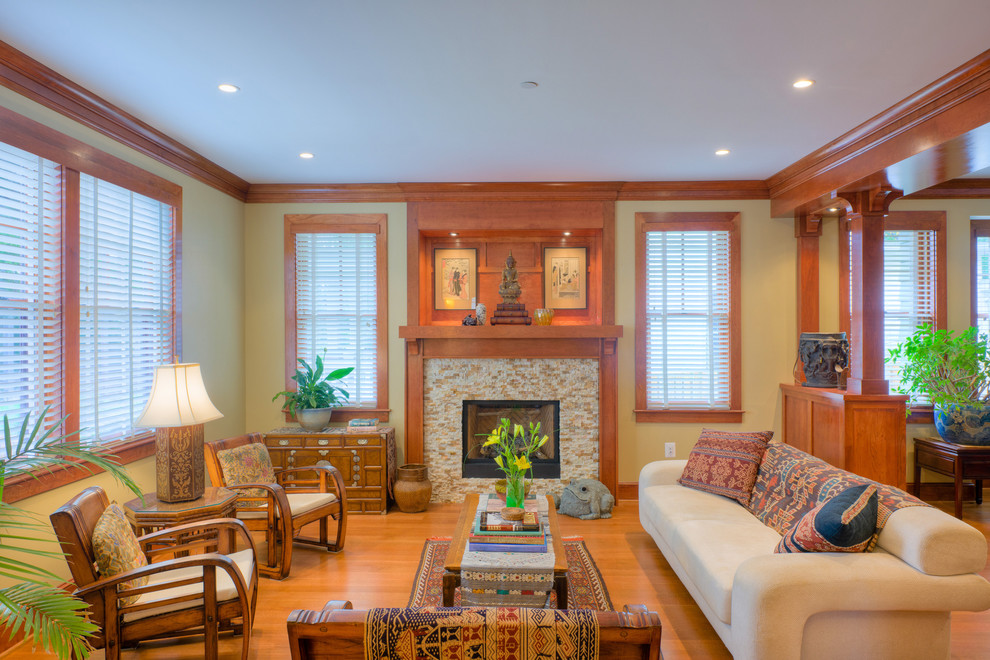 Photo of an arts and crafts living room in DC Metro with a tile fireplace surround.