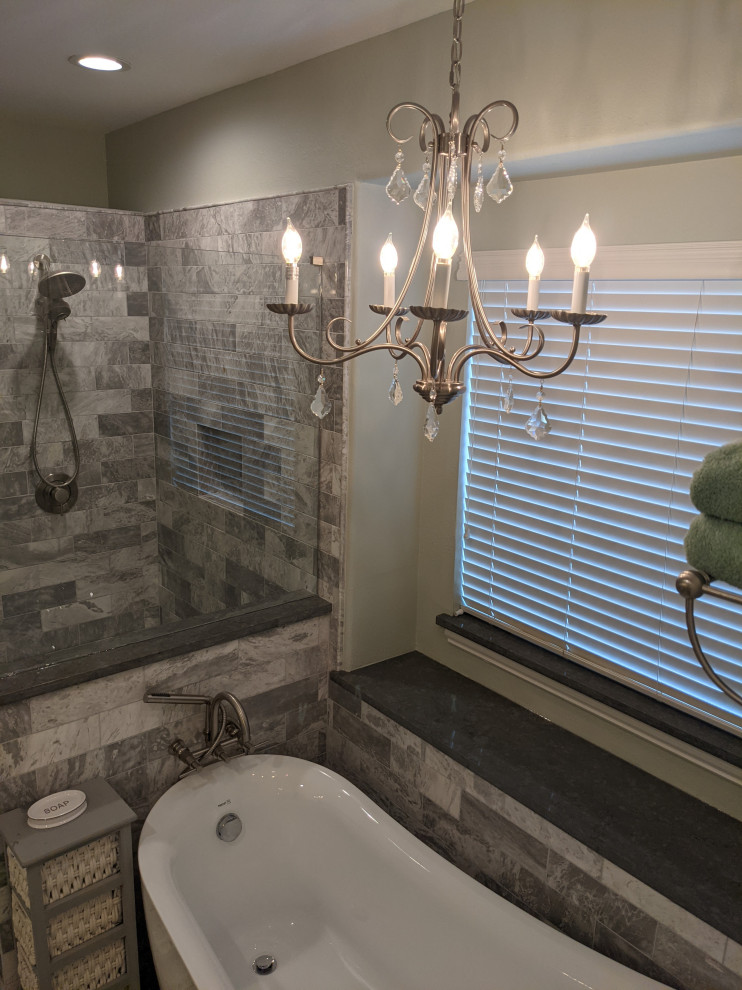Photo of a classic ensuite bathroom in Houston with raised-panel cabinets, white cabinets, a freestanding bath, a walk-in shower, a bidet, grey tiles, green walls, porcelain flooring, engineered stone worktops, a hinged door, grey worktops, a shower bench, double sinks and a built in vanity unit.