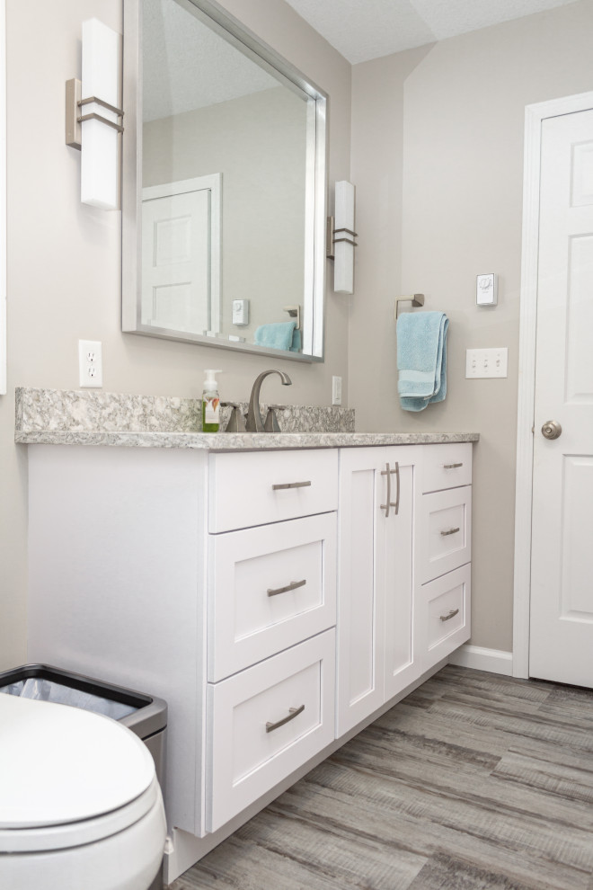 Bathroom - mid-sized transitional master gray floor and single-sink bathroom idea in Other with shaker cabinets, white cabinets, a two-piece toilet, green walls, an undermount sink, quartz countertops and gray countertops