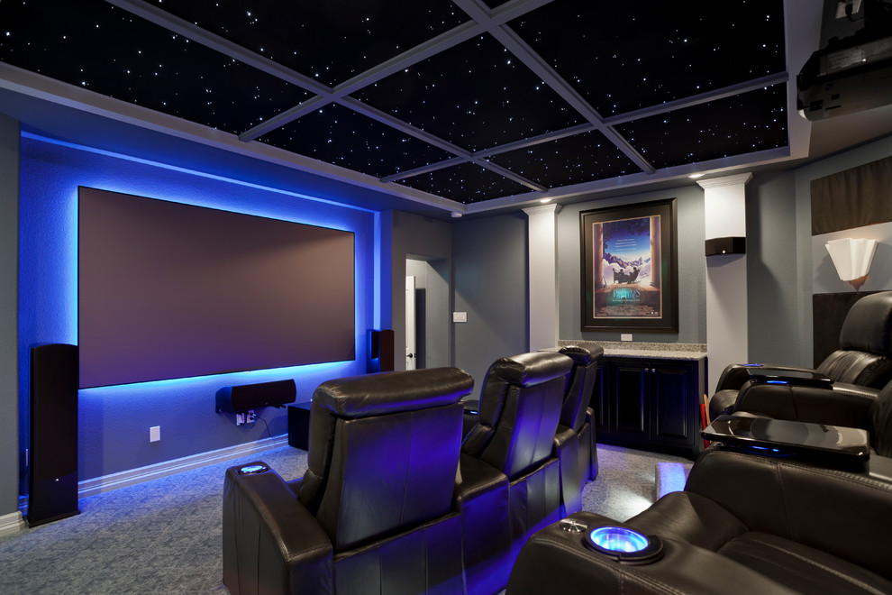 Inspiration for a contemporary home theatre in Austin with grey walls.