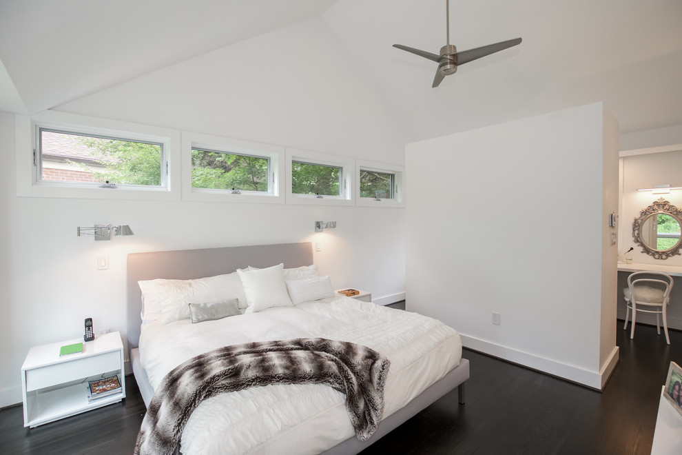 Photo of a mid-sized contemporary master bedroom in DC Metro with white walls, dark hardwood floors and no fireplace.