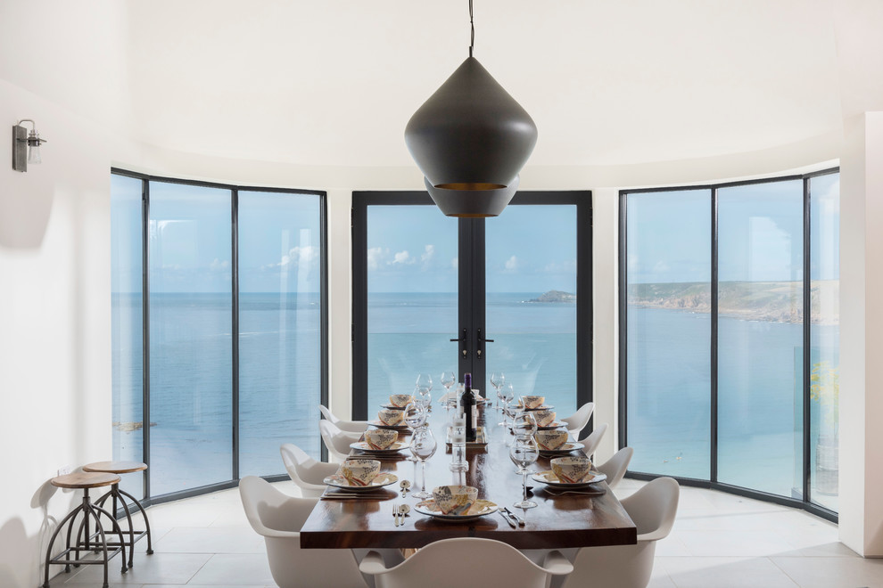 Photo of a contemporary dining room in Cornwall with white walls.