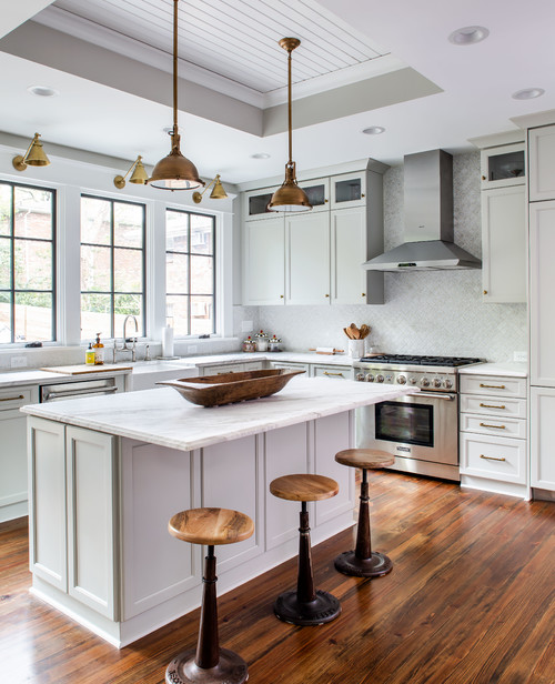 Timeless Appeal: Transitional White Kitchen Island Inspirations with White Cabinets and Brass Pendants