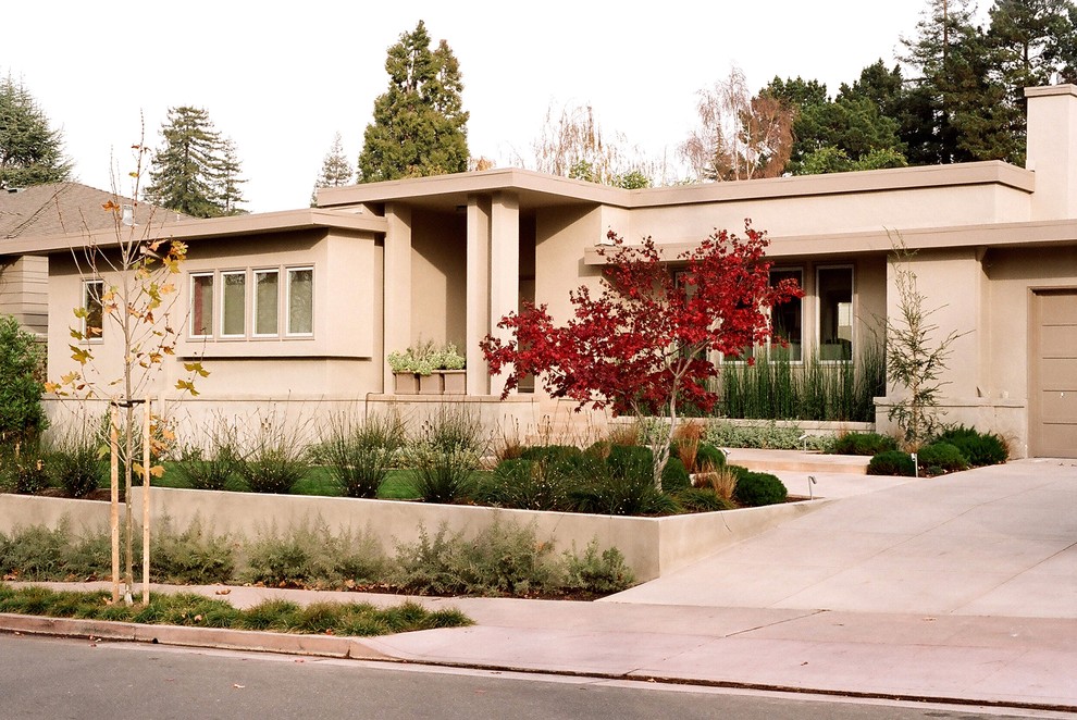This is an example of a mid-sized modern front yard full sun driveway in San Francisco with a garden path and concrete pavers.