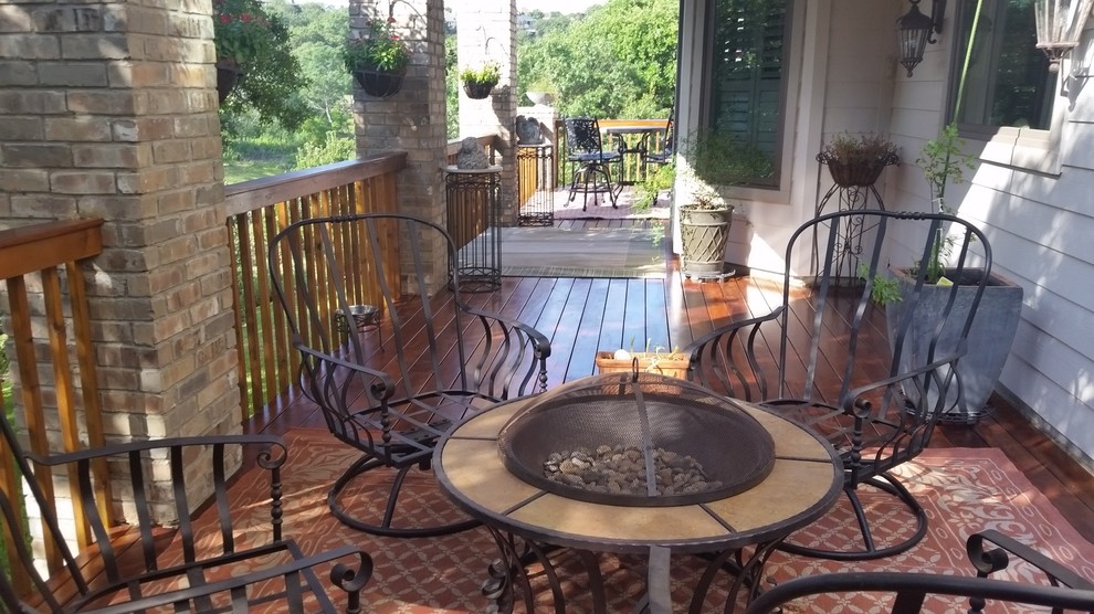 Deck - mid-sized transitional backyard deck idea in Austin with a fire pit and no cover