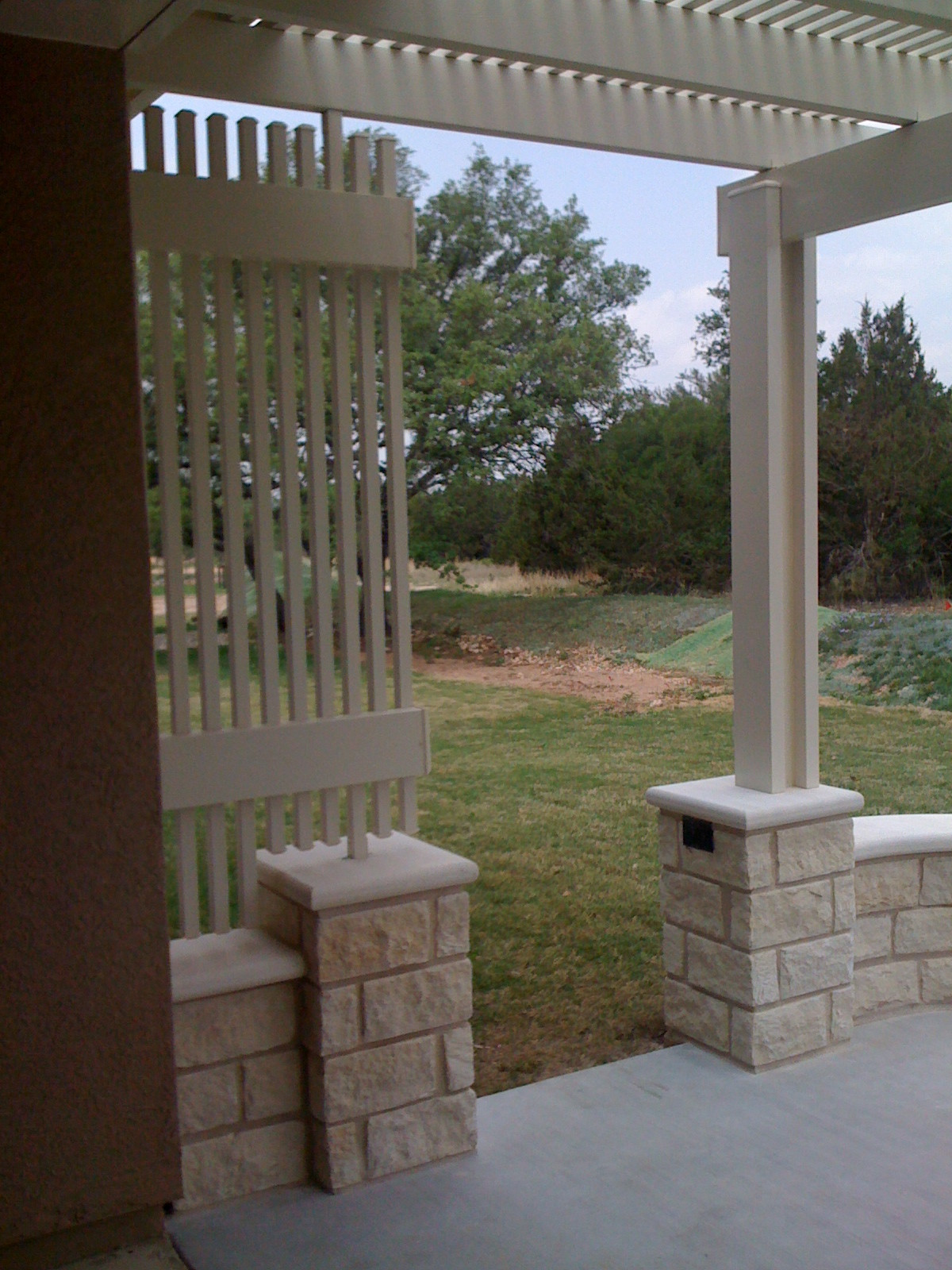 Concrete patio extension w/ decorative Alumawood privacy slats and pergola