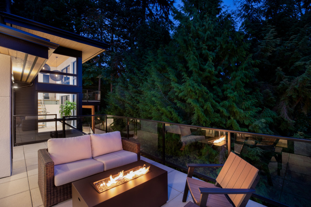 Large contemporary house exterior in Vancouver with mixed siding and a black roof.