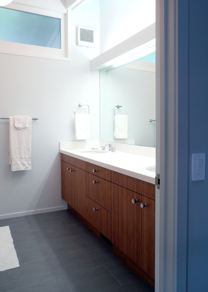 Design ideas for a midcentury bathroom in San Francisco with an undermount sink, slate floors and white walls.