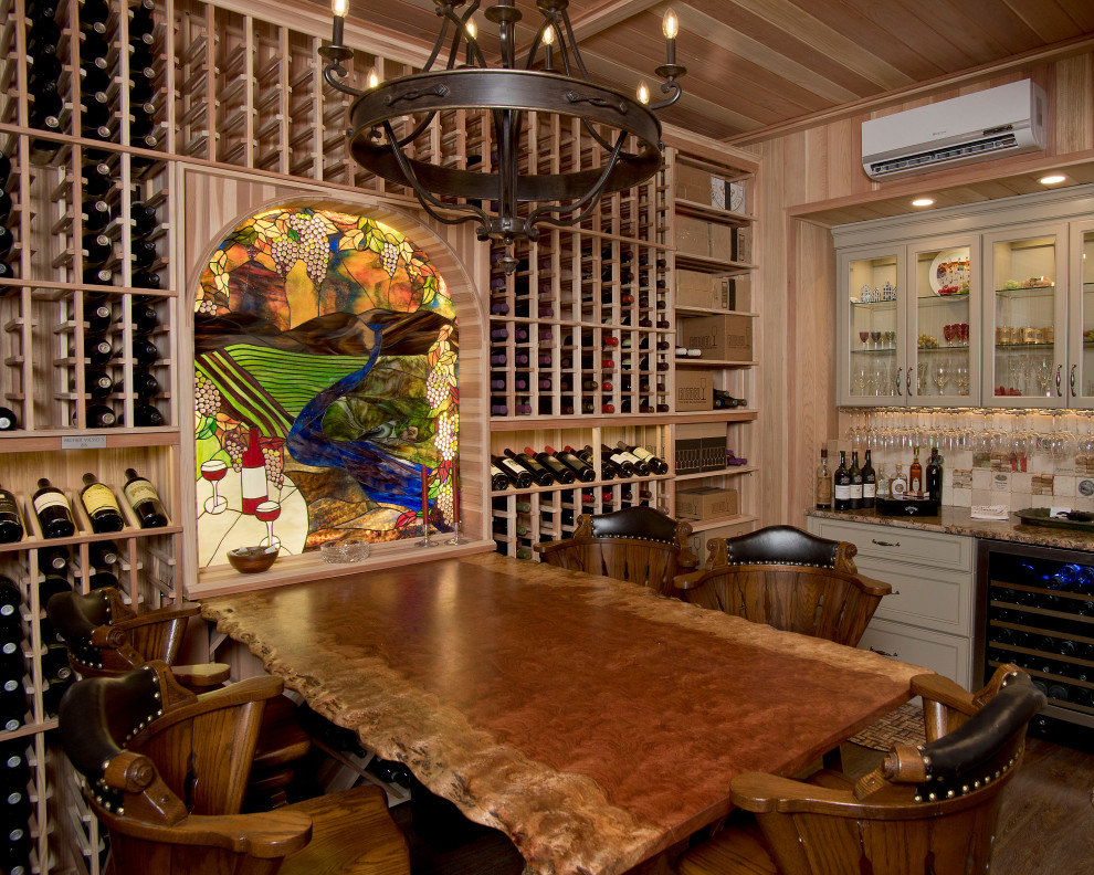 Example of a mountain style wine cellar design in Charlotte