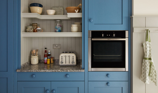 Inspiration for a mid-sized country galley open plan kitchen in Dublin with a single-bowl sink, shaker cabinets, blue cabinets, granite benchtops, panelled appliances, ceramic floors and no island.
