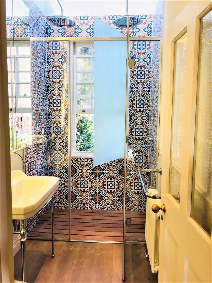 Design ideas for a contemporary bathroom in London with mosaic tile.