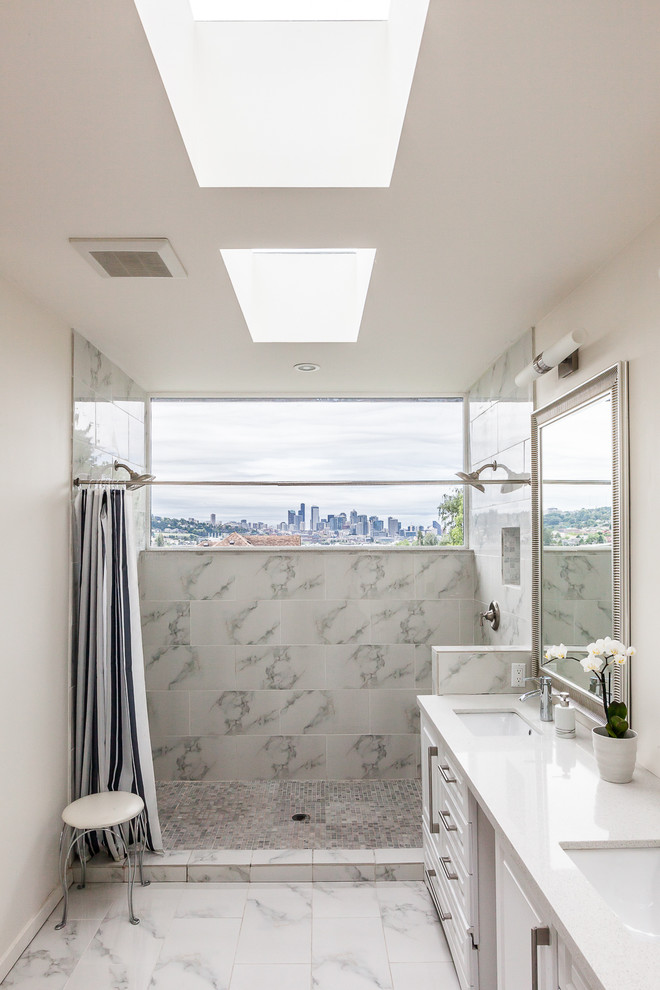 Design ideas for a mid-sized contemporary bathroom in Seattle with white cabinets, a double shower, white walls, white tile and stone tile.