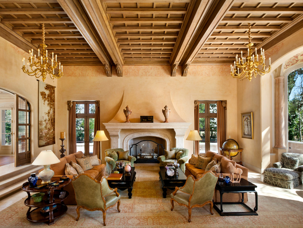 Design ideas for a large mediterranean formal enclosed living room in San Francisco with beige walls, a standard fireplace, no tv, a stone fireplace surround and carpet.