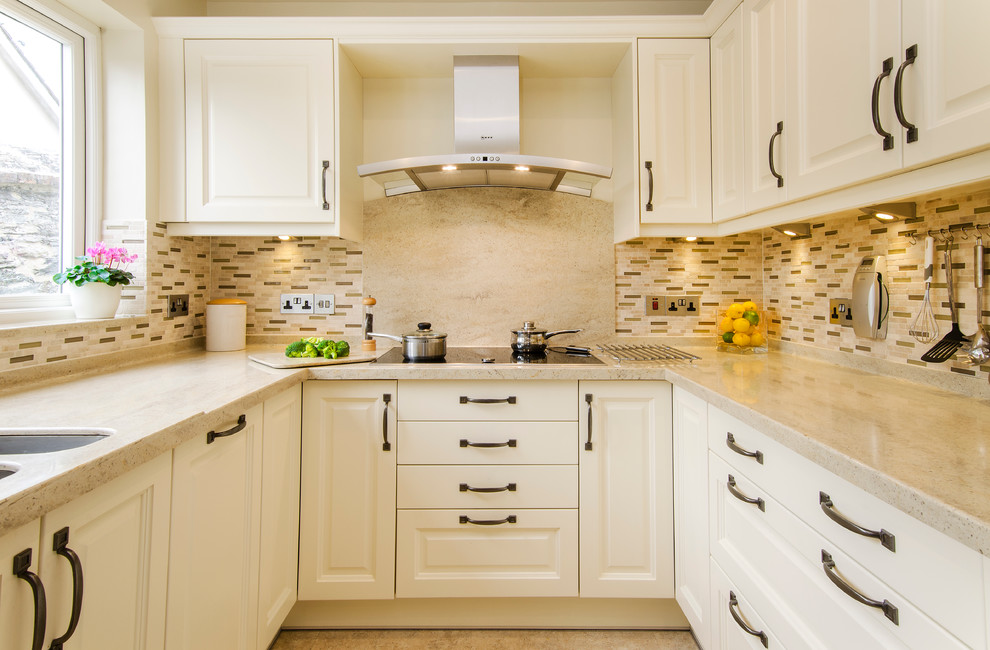 Inspiration for a small traditional u-shaped separate kitchen in Cornwall with a double-bowl sink, beaded inset cabinets, quartzite benchtops, brown splashback, ceramic splashback, stainless steel appliances and no island.