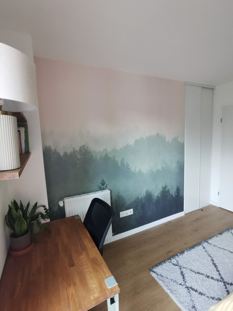 Example of a mid-sized mountain style master medium tone wood floor, brown floor and wallpaper bedroom design in Paris with green walls