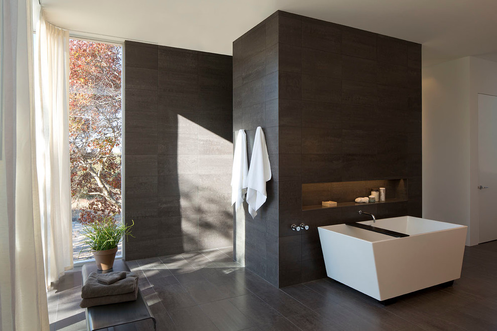 Large contemporary master bathroom in Austin with a freestanding tub, an alcove shower, gray tile, porcelain tile, grey walls and porcelain floors.