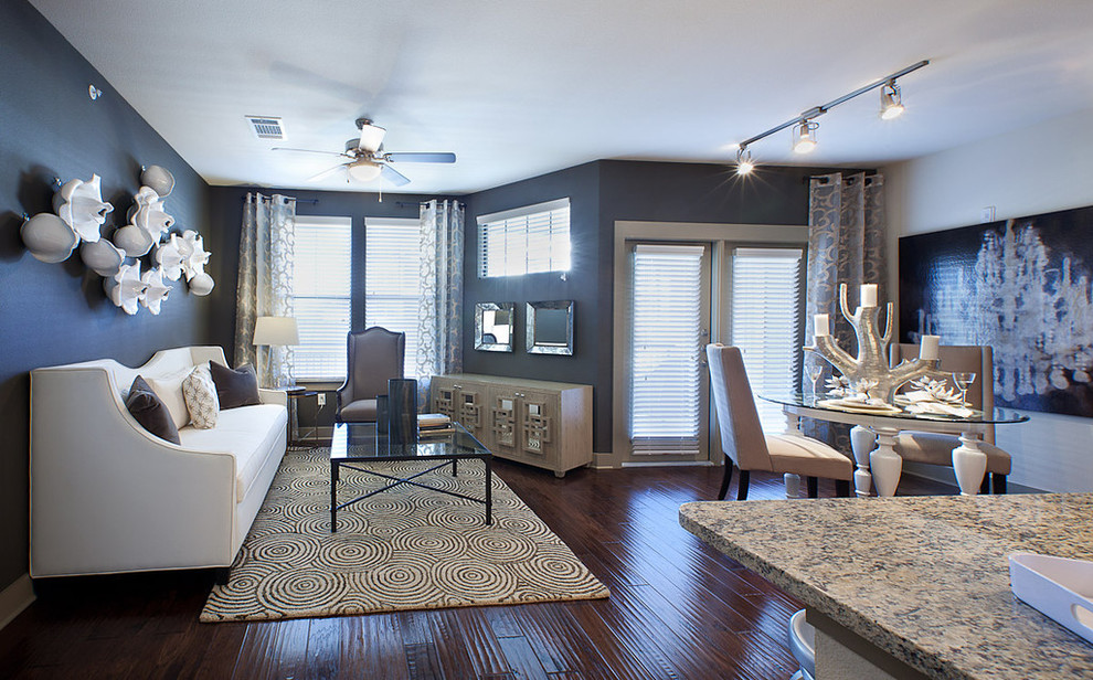Mid-sized transitional open concept living room in Dallas with grey walls, dark hardwood floors and a freestanding tv.