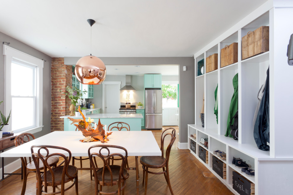 Design ideas for a transitional open plan dining in New York with grey walls.