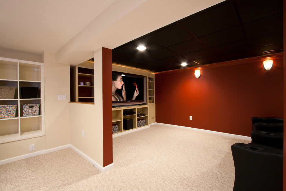 Inspiration for a large traditional open concept home theatre in Newark with red walls, carpet and a built-in media wall.