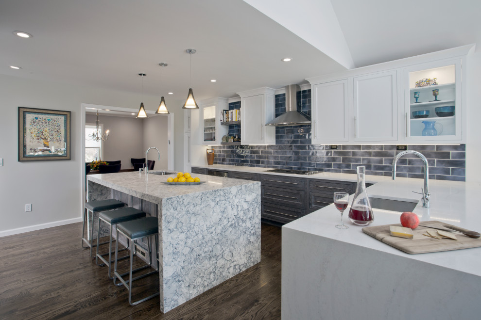 Design ideas for a large transitional l-shaped eat-in kitchen in New York with an undermount sink, recessed-panel cabinets, medium wood cabinets, quartz benchtops, blue splashback, ceramic splashback, dark hardwood floors, with island, brown floor and multi-coloured benchtop.