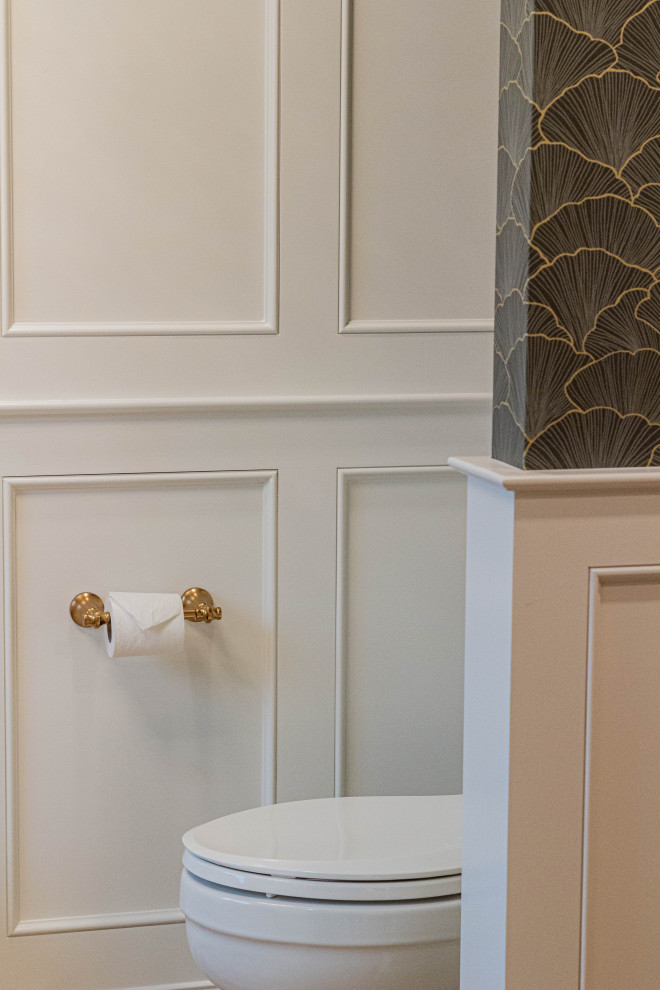 Inspiration for a large transitional master white tile and stone slab porcelain tile, beige floor, double-sink and wall paneling freestanding bathtub remodel with beaded inset cabinets, light wood cabinets, a two-piece toilet, gray walls, an undermount sink, quartz countertops, a hinged shower door, white countertops, a niche and a built-in vanity
