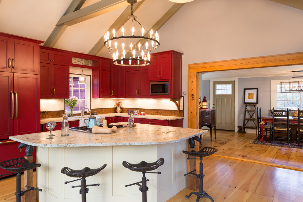 Photo of a country eat-in kitchen in Boston with a farmhouse sink, recessed-panel cabinets and red cabinets.