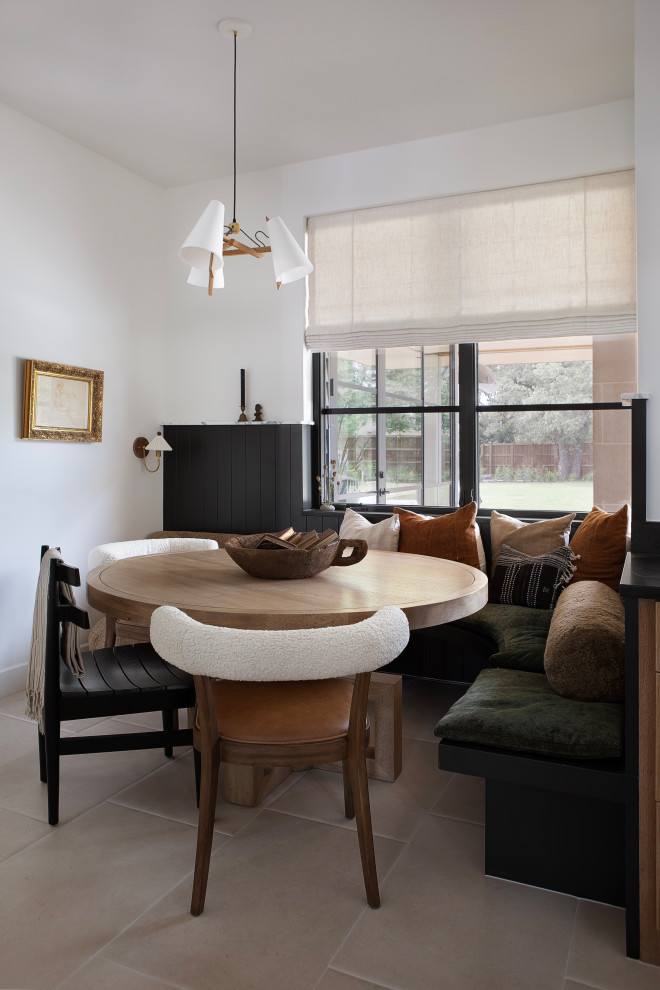 Hill Country Modern Meets Southlake, Texas - This Hill Country Modern home in Southlake combines modern design with comfort, featuring light-filled spaces and unique details reflecting the family's eclectic style for play and sophistication. 

This breakfast area features elegant furniture in earthy tones, creating a warm and inviting space perfect for family gatherings. Natural light enhances the cozy atmosphere, making it ideal for relaxed meals.