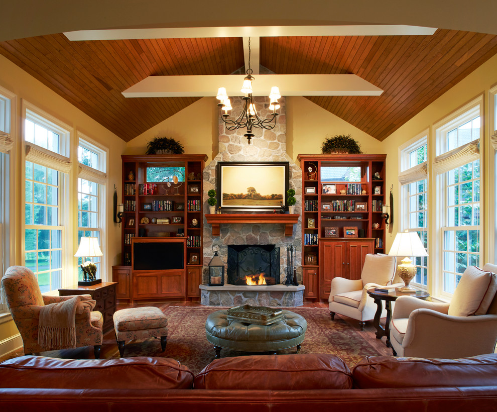 This is an example of a traditional formal enclosed living room in Minneapolis with white walls, a standard fireplace and a stone fireplace surround.