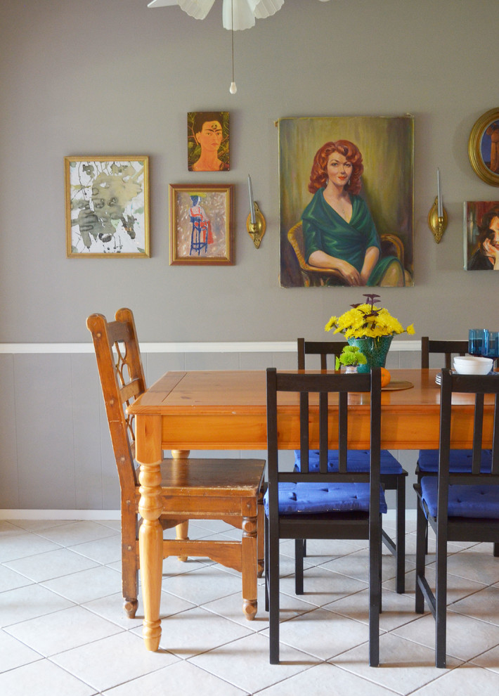 This is an example of an eclectic dining room in Austin with grey walls.