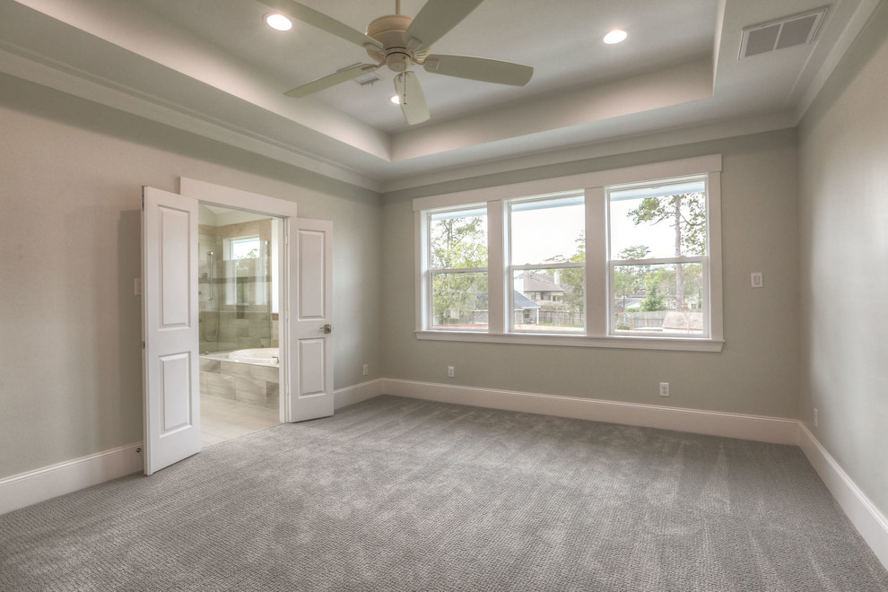 Inspiration for a large transitional master carpeted and gray floor bedroom remodel in Houston with no fireplace