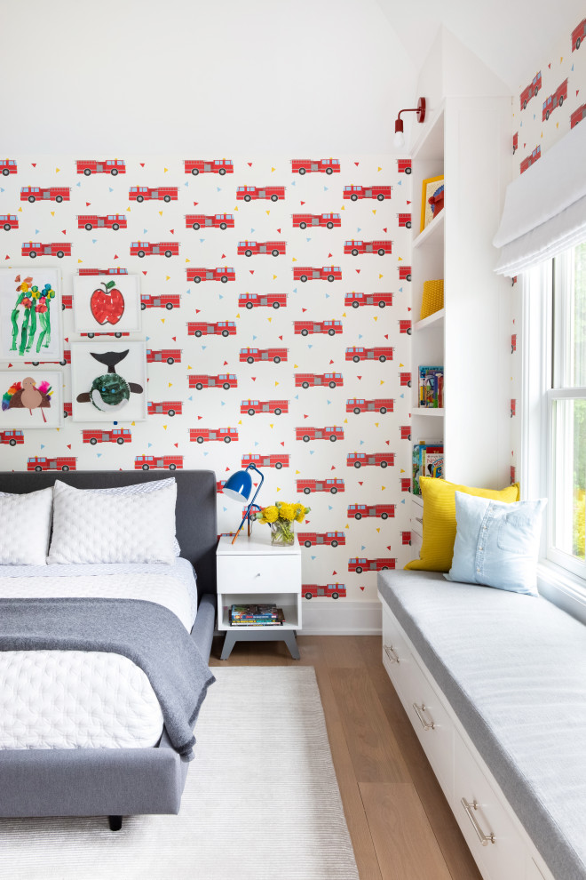 Medium sized classic kids' bedroom for boys in New York with multi-coloured walls, light hardwood flooring, brown floors, a timber clad ceiling and wallpapered walls.