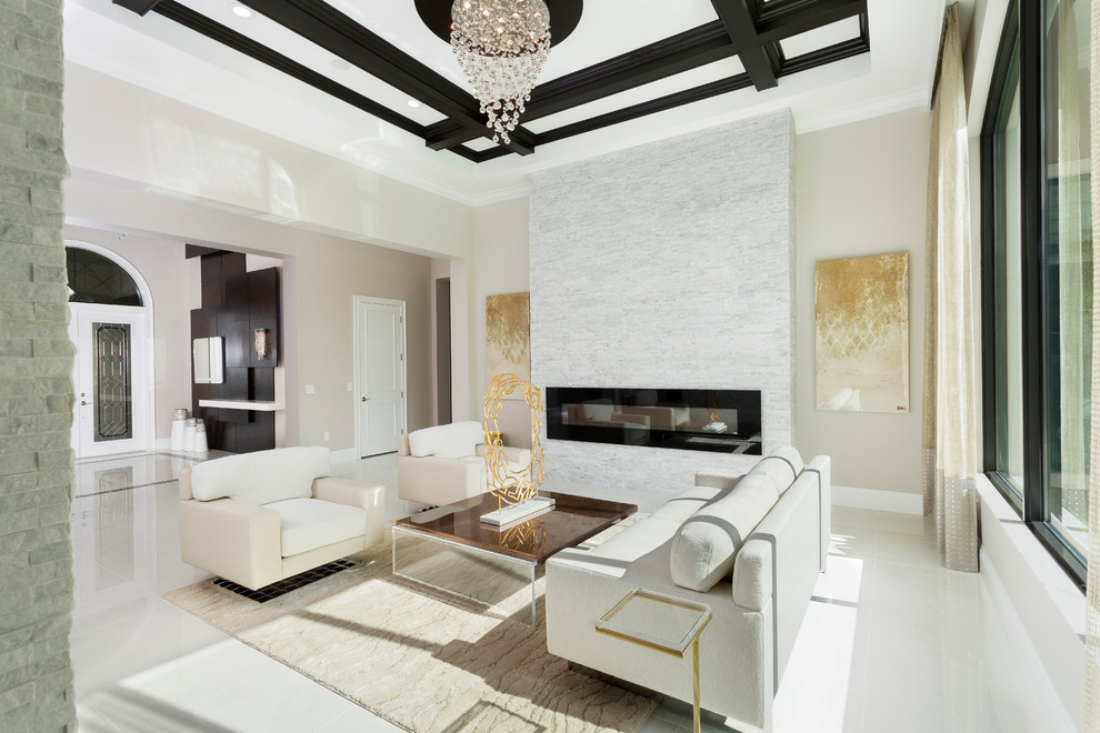 Photo of a transitional formal open concept living room in Miami with beige walls, a ribbon fireplace and white floor.