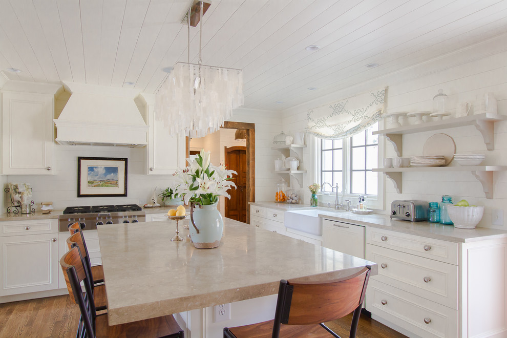 Photo of a traditional kitchen in Atlanta with a farmhouse sink, open cabinets and white cabinets.