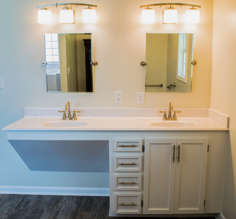 Design ideas for a large transitional master bathroom in Other with recessed-panel cabinets, white cabinets, a two-piece toilet, beige walls, ceramic floors, marble benchtops, a curbless shower, an integrated sink and brown floor.
