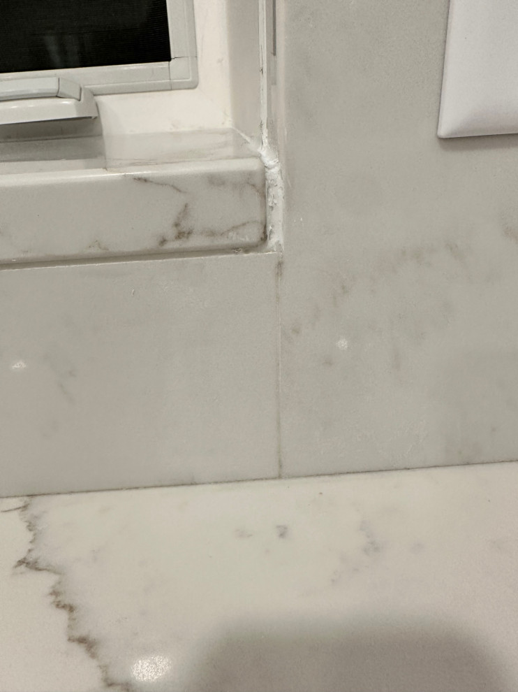 Quartz Backsplash Seams too much adhesive