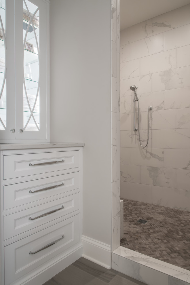 Expansive traditional master bathroom in St Louis with beaded inset cabinets, white cabinets, a freestanding tub, an open shower, a two-piece toilet, medium hardwood floors, an undermount sink, engineered quartz benchtops, brown floor and white benchtops.
