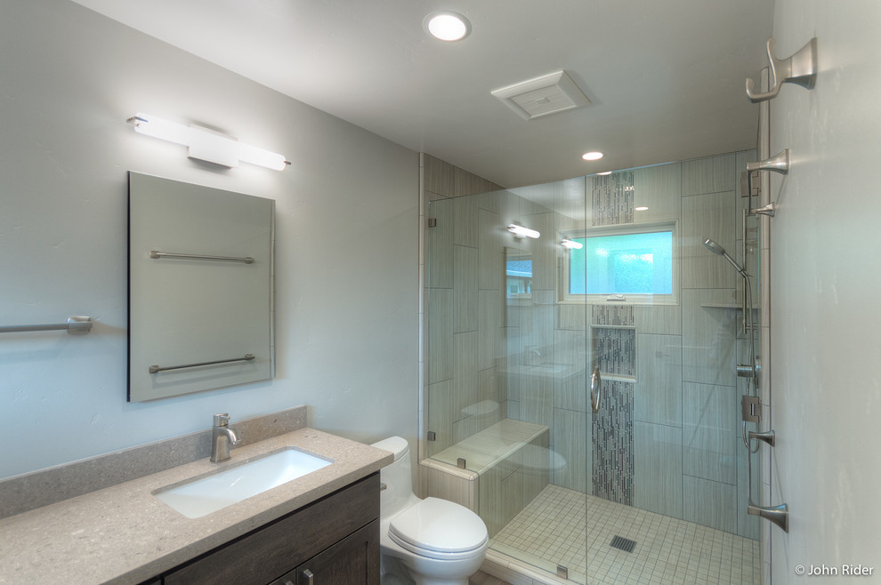 Small contemporary master bathroom in San Francisco with recessed-panel cabinets, distressed cabinets, a corner shower, beige tile, porcelain tile, white walls and porcelain floors.