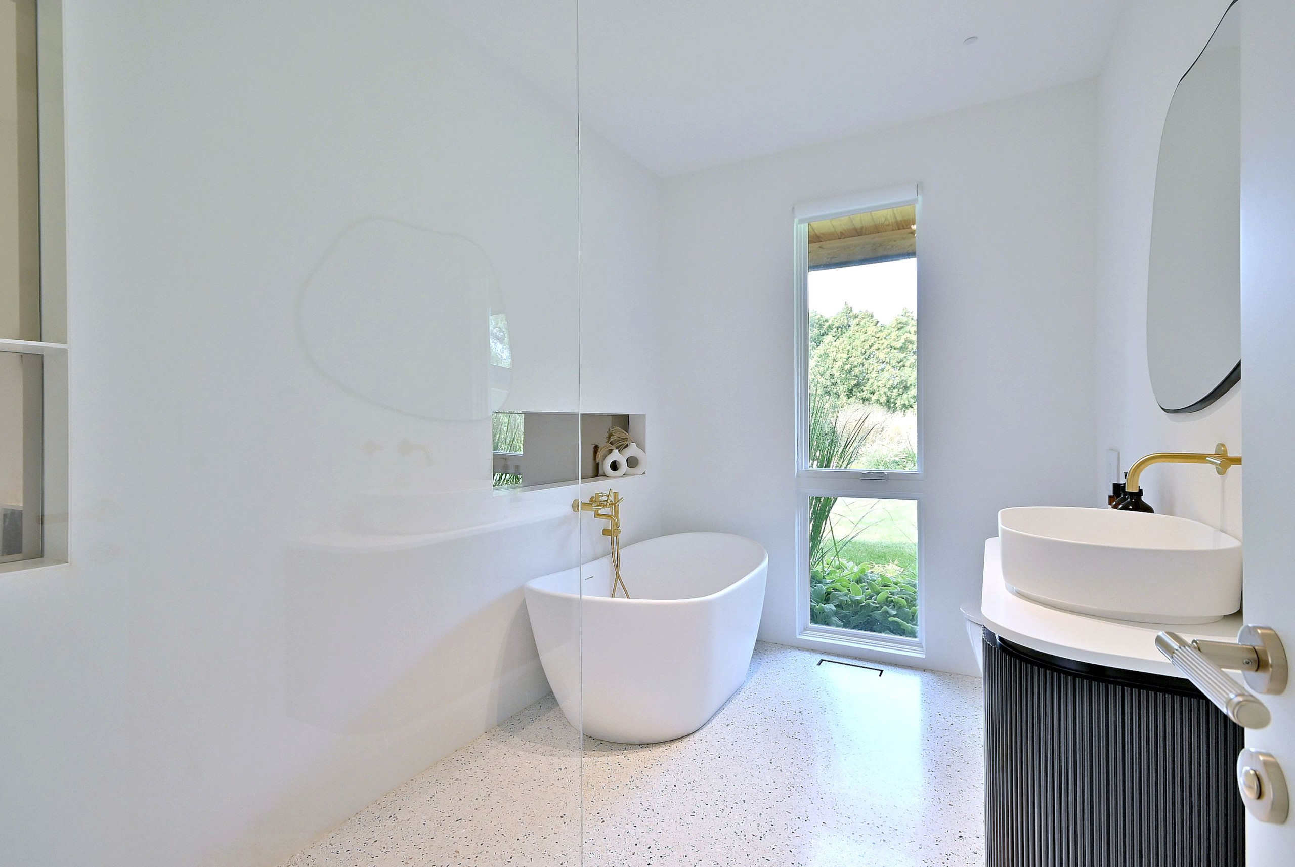 Mid-Century Modern Bathroom with Freestanding Tub